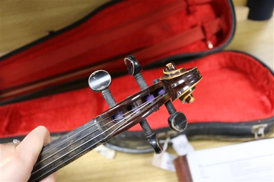 A Rosetti violin bearing faux Stradivarius label, cased with bow